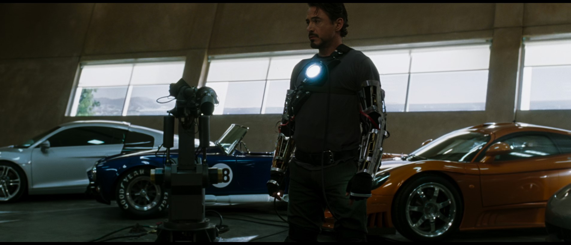 Tony Stark with an arc generator inserted into his body (Source - Iron Man 1)